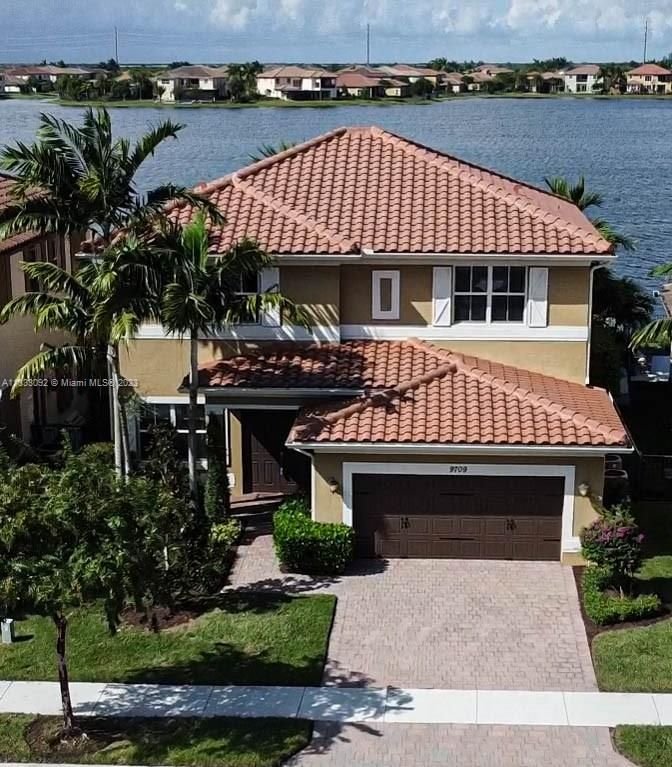 Real estate property located at 9709 Blue Isle Bay, Broward County, Parkland, FL