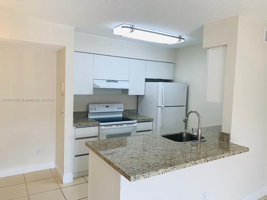 Real estate property located at 10477 7th St #104, Broward, BELLA GRAND CONDO, Pembroke Pines, FL