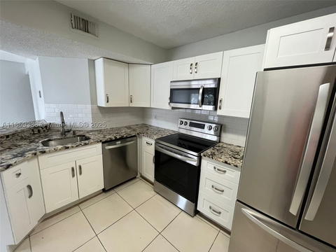 Real estate property located at 8821 Wiles Rd #203, Broward, Edgewater Condo, Coral Springs, FL
