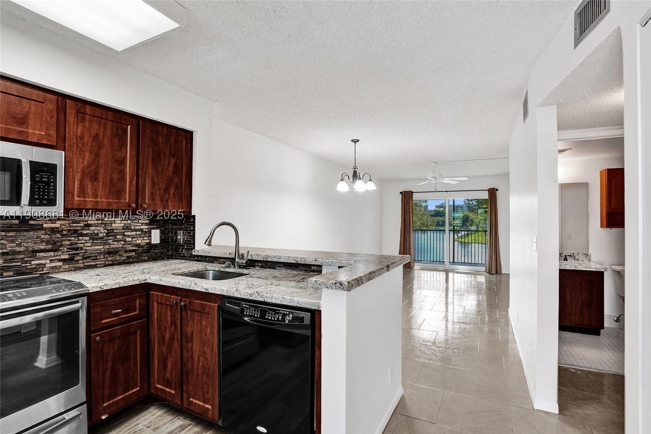 Real estate property located at 2220 Cypress Bend Dr #310, Broward, Cypress Bend Condominium, Pompano Beach, FL