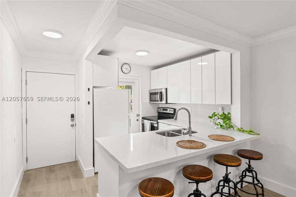 Real estate property located at 1650 Le Jeune Rd #105, Miami-dade, Madrid Towers Condo, Coral Gables, FL